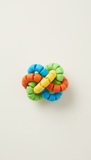 FlexiTwist silicone ring toy, perfectly centered horizontally and vertically with equal negative space above and below,...