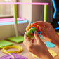 FlexiTwist silicone ring toy in use