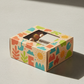 A vibrant DIY craft kit featuring eco-friendly packaging with colorful designs displayed at a perfect 3/4 angle view on a...