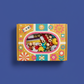 A DIY craft kit packaged in a retro-style box, perfectly centered against a clean background of Electric Indigo. The...